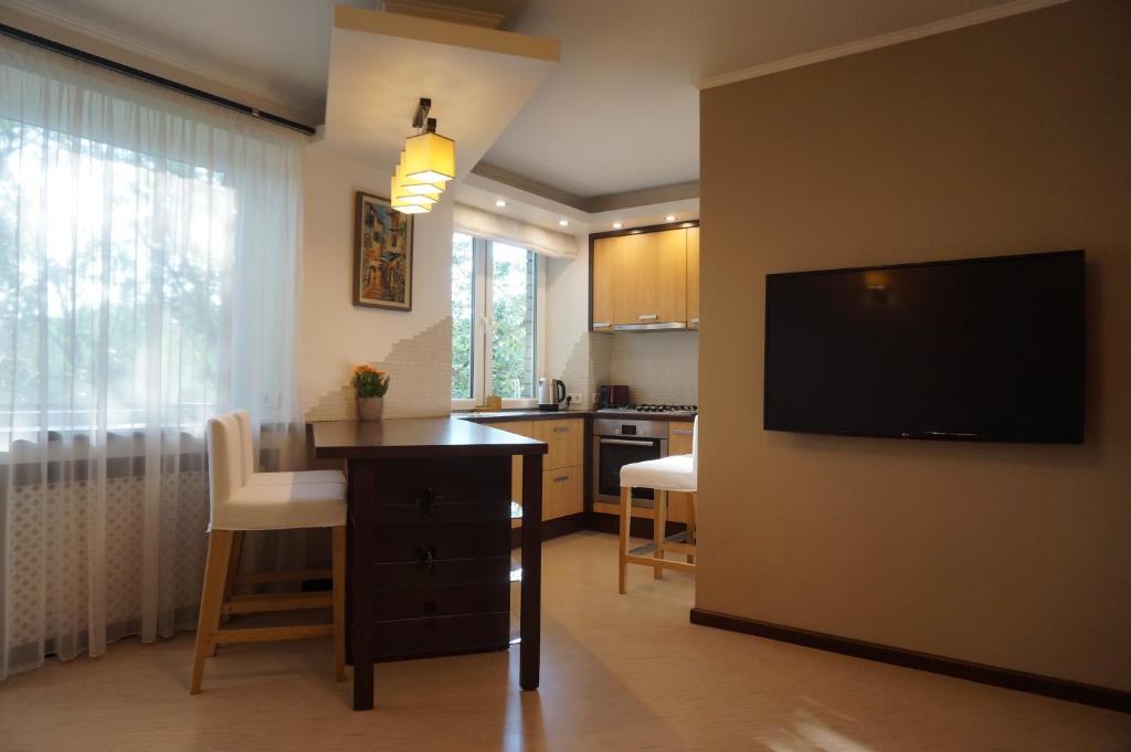 a kitchen with a desk and a television in a room at apartment 22 in Riga