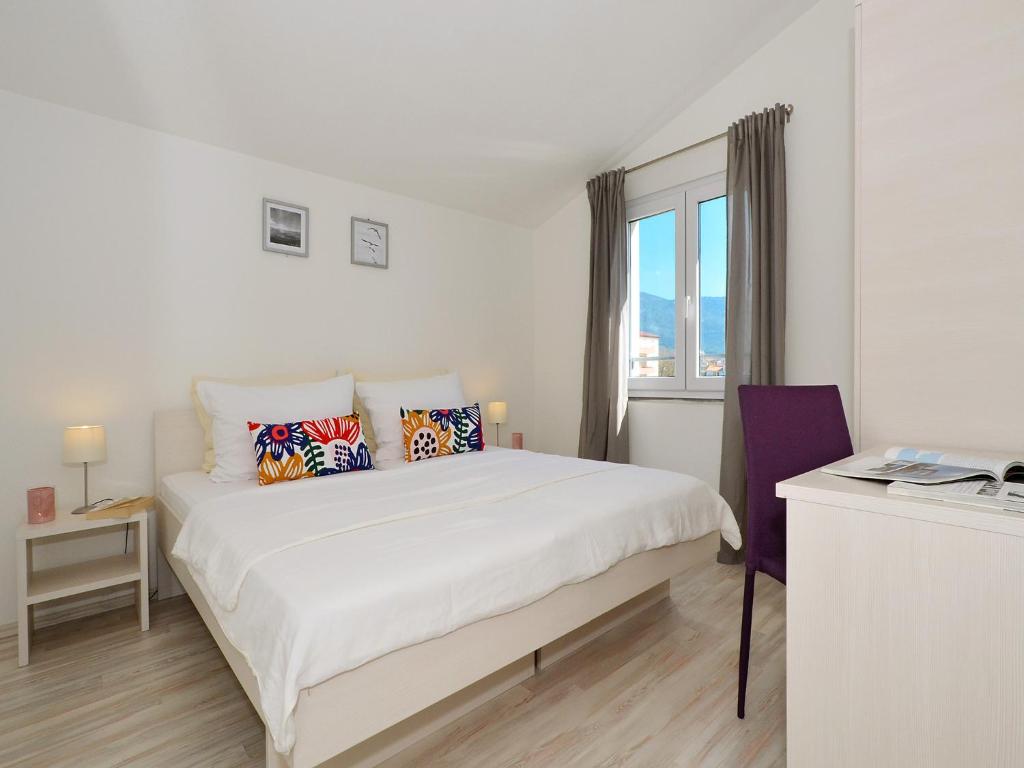 Säng eller sängar i ett rum på Apartments Ante Anita