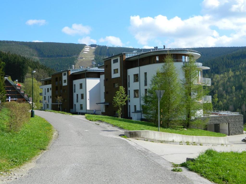 an empty street in a town with buildings at Apartmány Michael in Špindlerův Mlýn