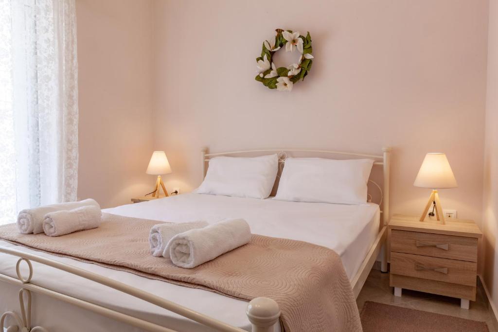 Posteľ alebo postele v izbe v ubytovaní John Apartments