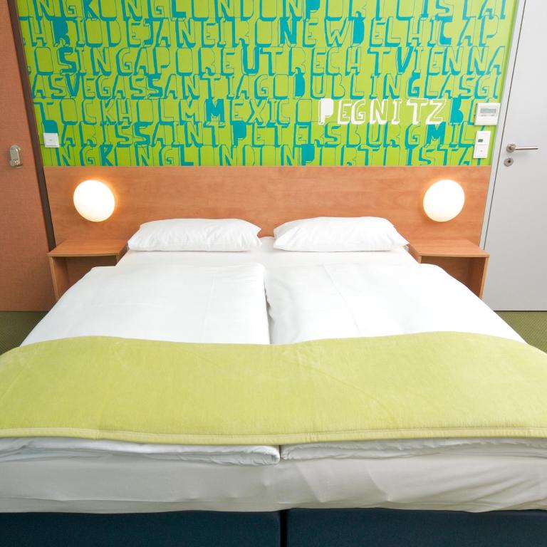 Postel nebo postele na pokoji v ubytování Hotel Fränkische Schweiz-Pegnitz
