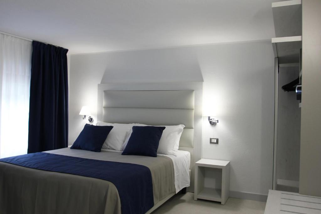 Postel nebo postele na pokoji v ubytování Park Hotel Giusy