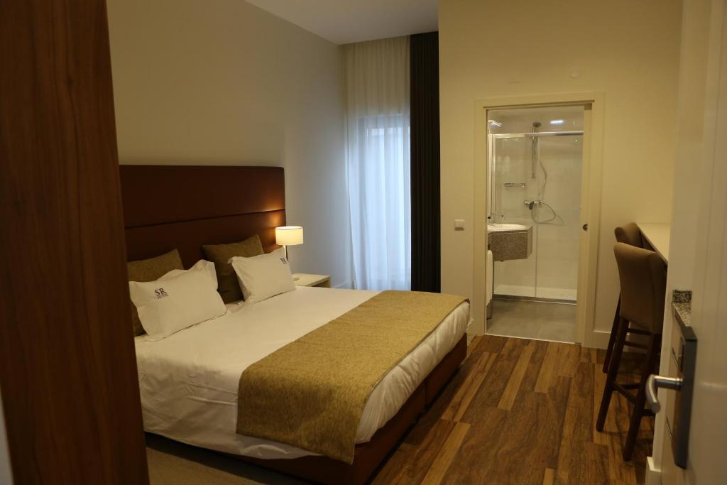 Postel nebo postele na pokoji v ubytování Hotel Solar do Rebolo