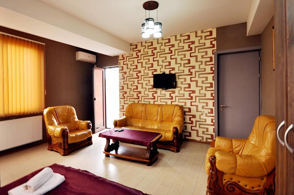 TV a/nebo společenská místnost v ubytování Hotel Kavela