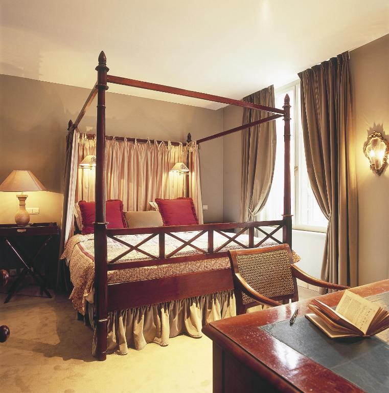 Postel nebo postele na pokoji v ubytování B&B Maison le Dragon