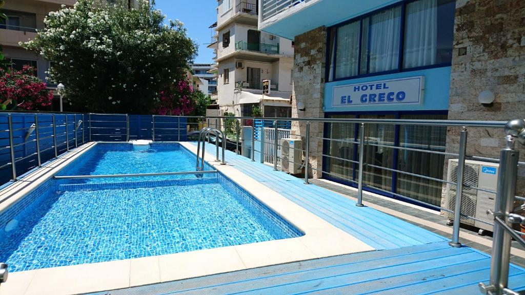 a swimming pool on the side of a building at EL GRECO in Rhodes Town