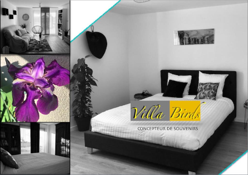 a bedroom with a bed with a purple flower on it at VILLA BIRDS in Boran-sur-Oise