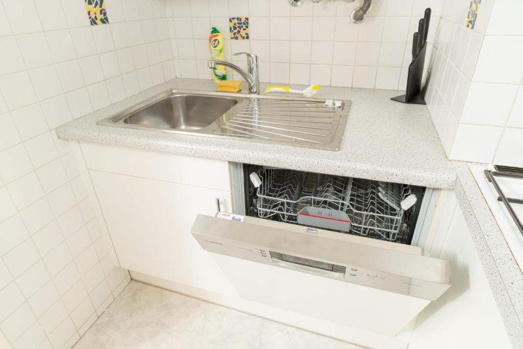 Kuchyňa alebo kuchynka v ubytovaní Szene Wien Apartment