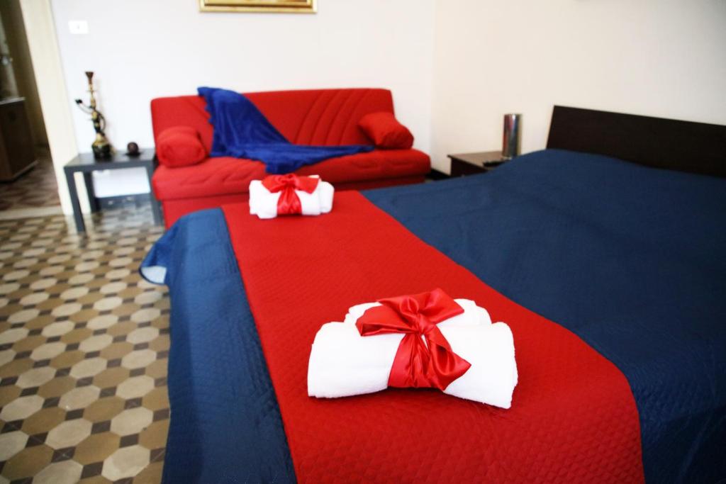 Postel nebo postele na pokoji v ubytování Pitagora House