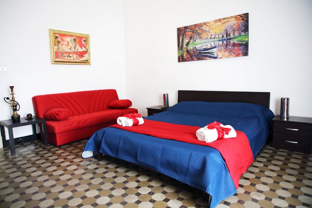 Postel nebo postele na pokoji v ubytování Pitagora House