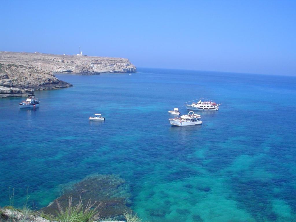 a group of boats in a large body of water at Oasi Di Casablanca in Lampedusa