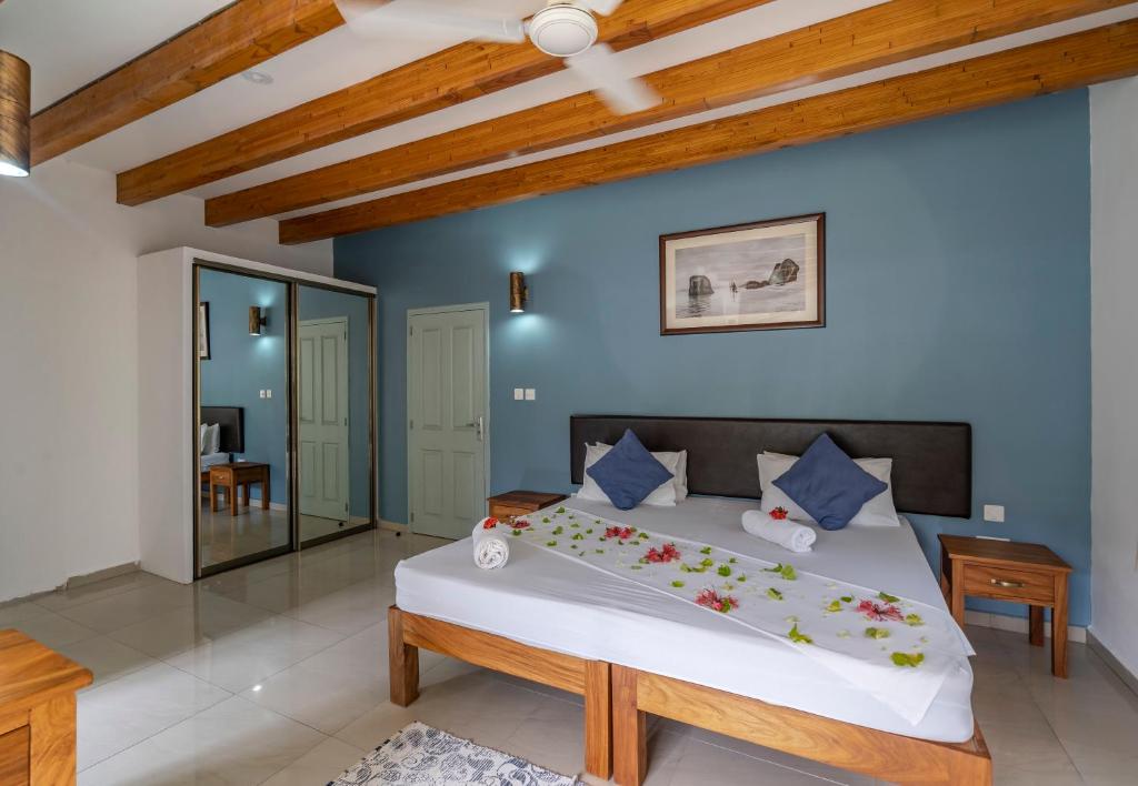 Postel nebo postele na pokoji v ubytování La Modestie Guest House