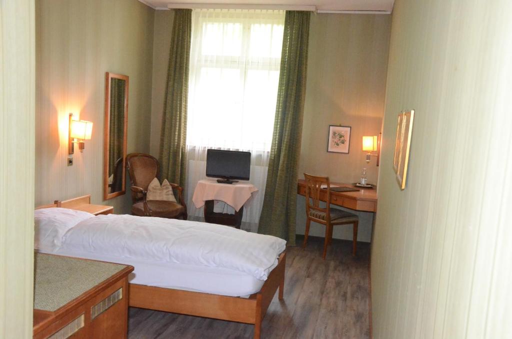 Letto o letti in una camera di Gasthof Löwen Worb bei Bern