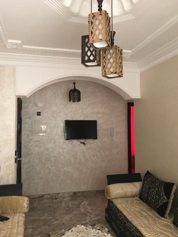 TV a/nebo společenská místnost v ubytování Appartements M'diq