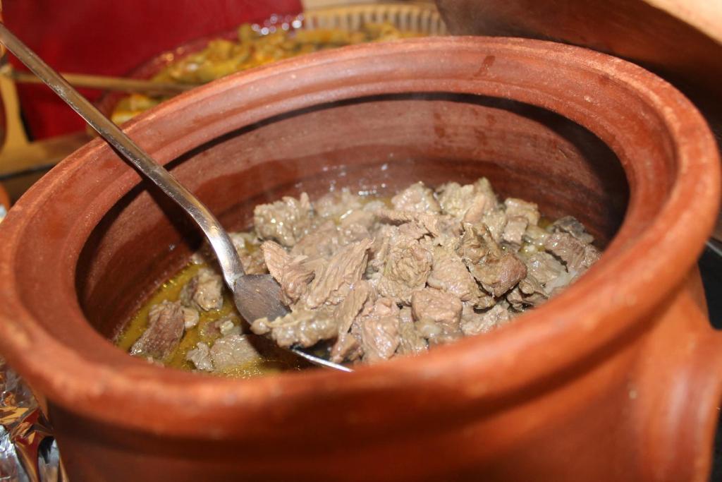 a bowl of food with a spoon in it at Yeşilyurt Residence in İzmir