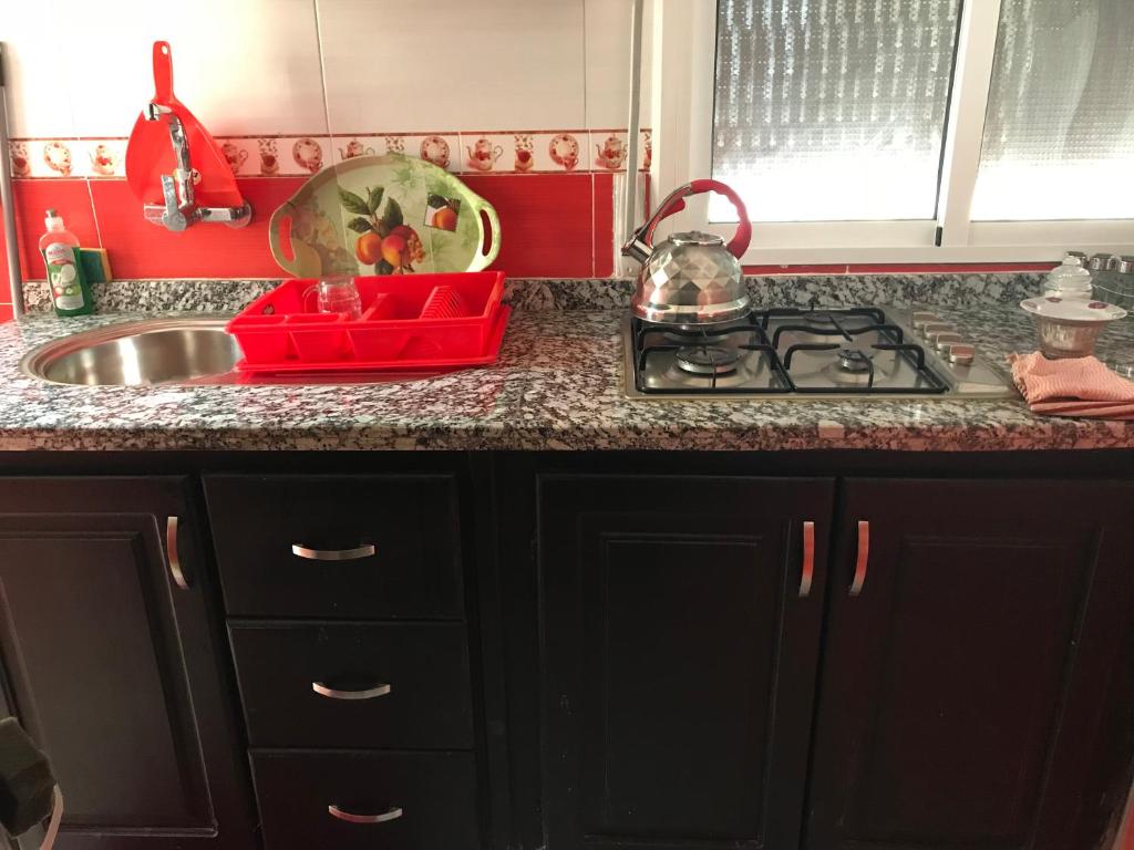 Kuchyň nebo kuchyňský kout v ubytování Appartements M'diq