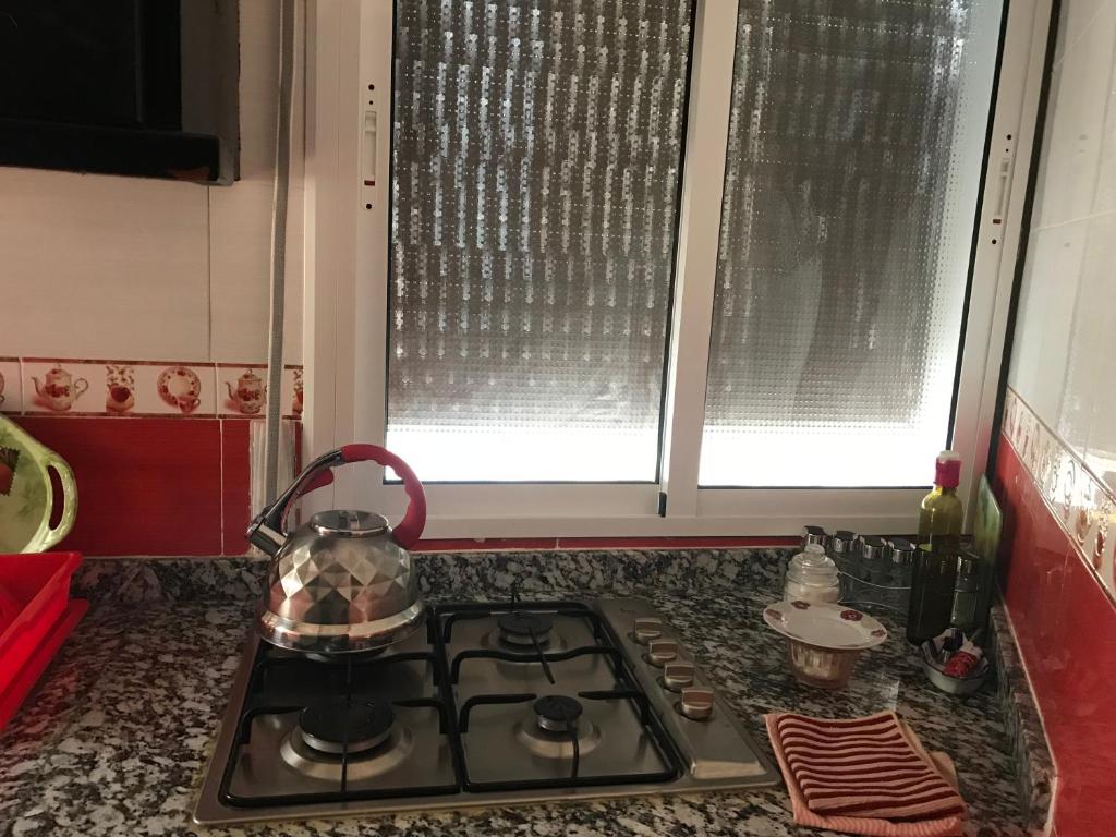 Kuchyň nebo kuchyňský kout v ubytování Appartements M'diq
