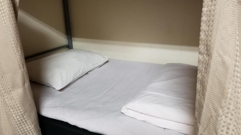 Voodi või voodid majutusasutuse KiyamachiGuesthousemixed room外国人向き toas