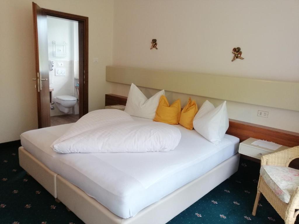 Postel nebo postele na pokoji v ubytování Hotel Tiffany