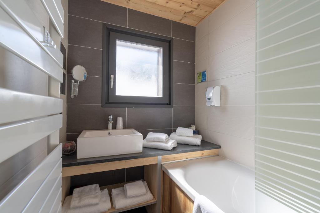 Koupelna v ubytování Chalet Les Rhodos