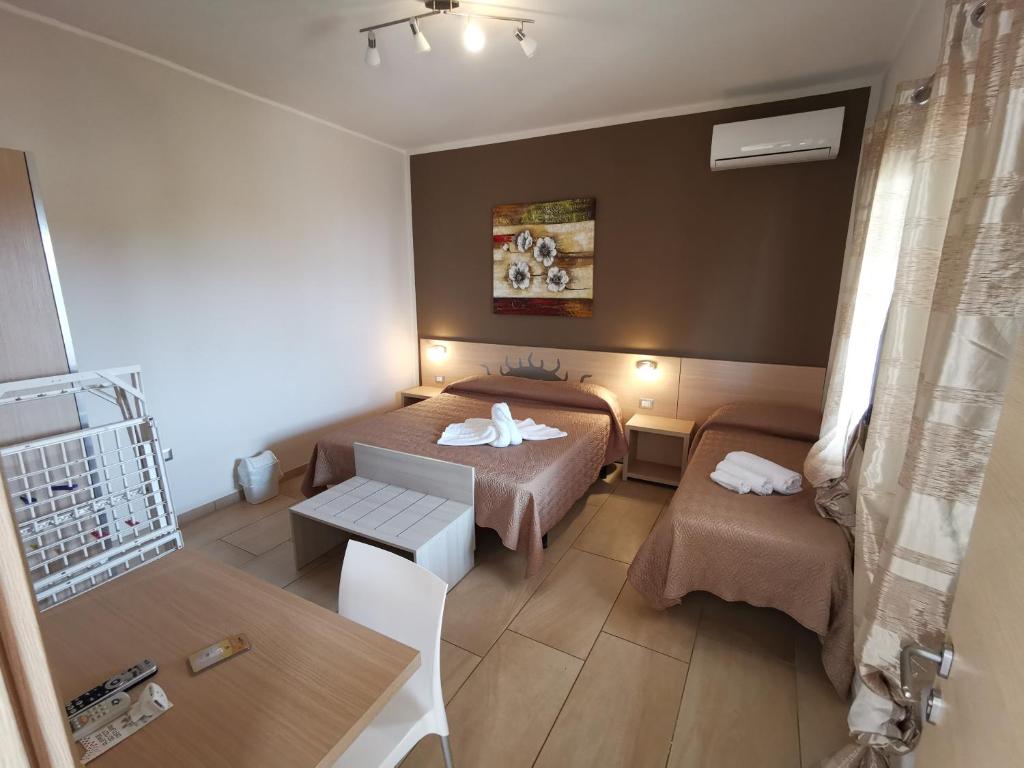 Кровать или кровати в номере Samanà B&B con Spiaggia Privata a Punta Prosciutto