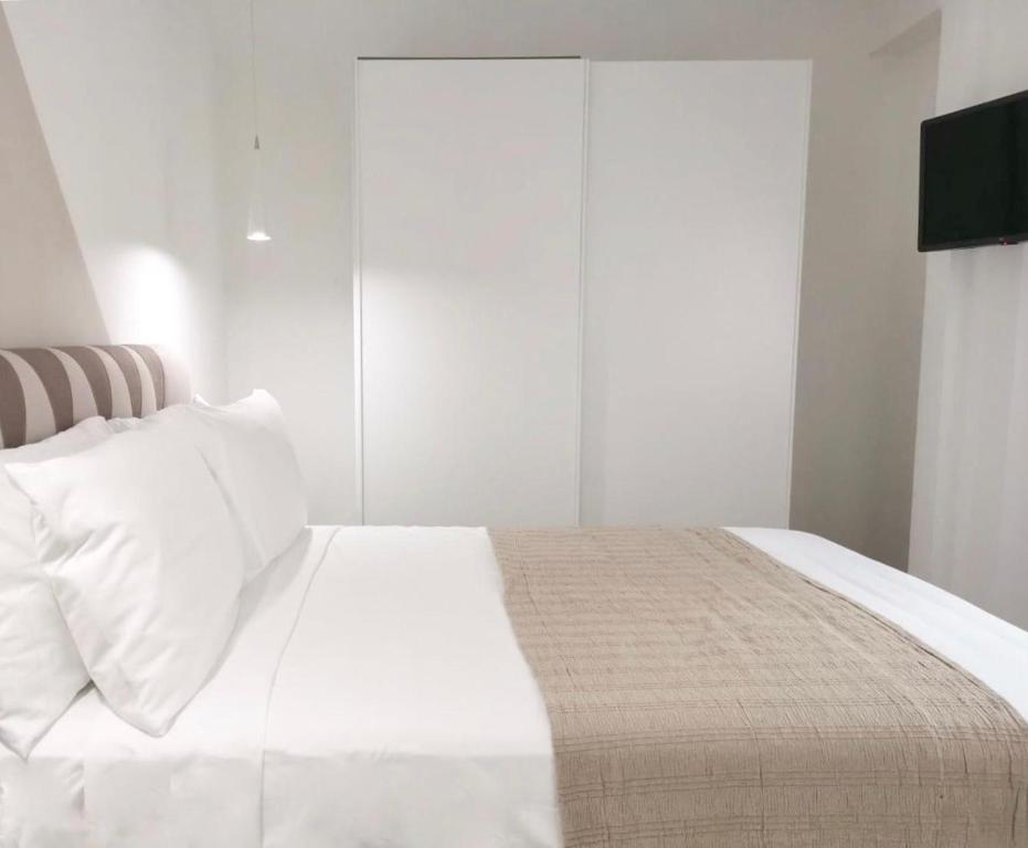 Posteľ alebo postele v izbe v ubytovaní SuitesGaribaldi