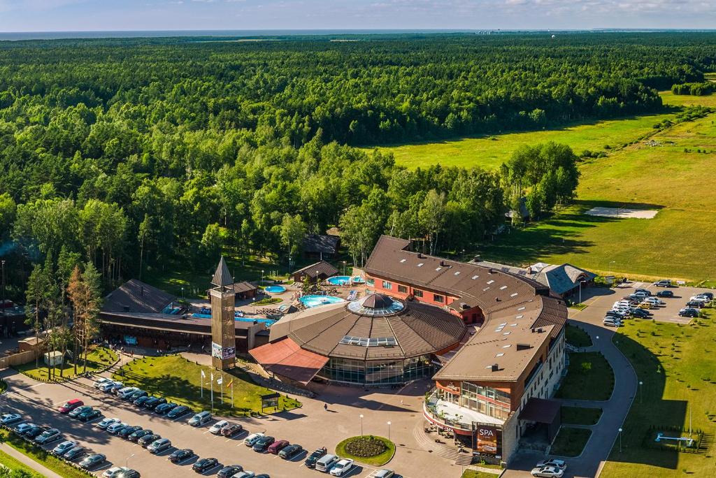 an aerial view of a building with a parking lot at Meguva Resort Hotel in Palanga