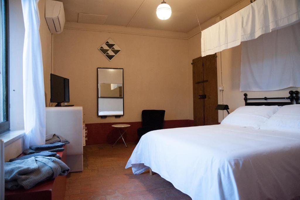 Postel nebo postele na pokoji v ubytování Corte Mantovanella