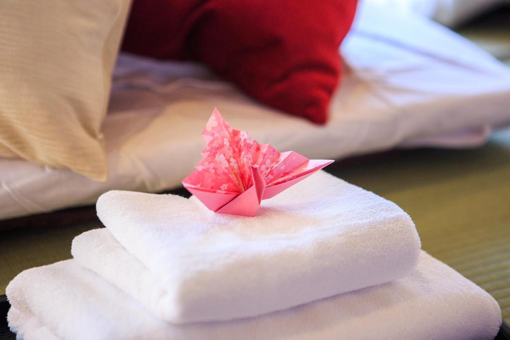 Postel nebo postele na pokoji v ubytování ORIGAMI STAY -Taishocho-