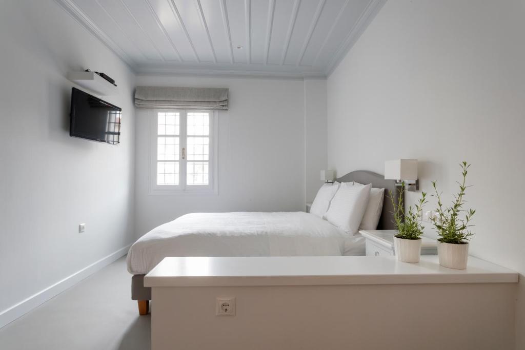 Postel nebo postele na pokoji v ubytování Guesthouse Niriides