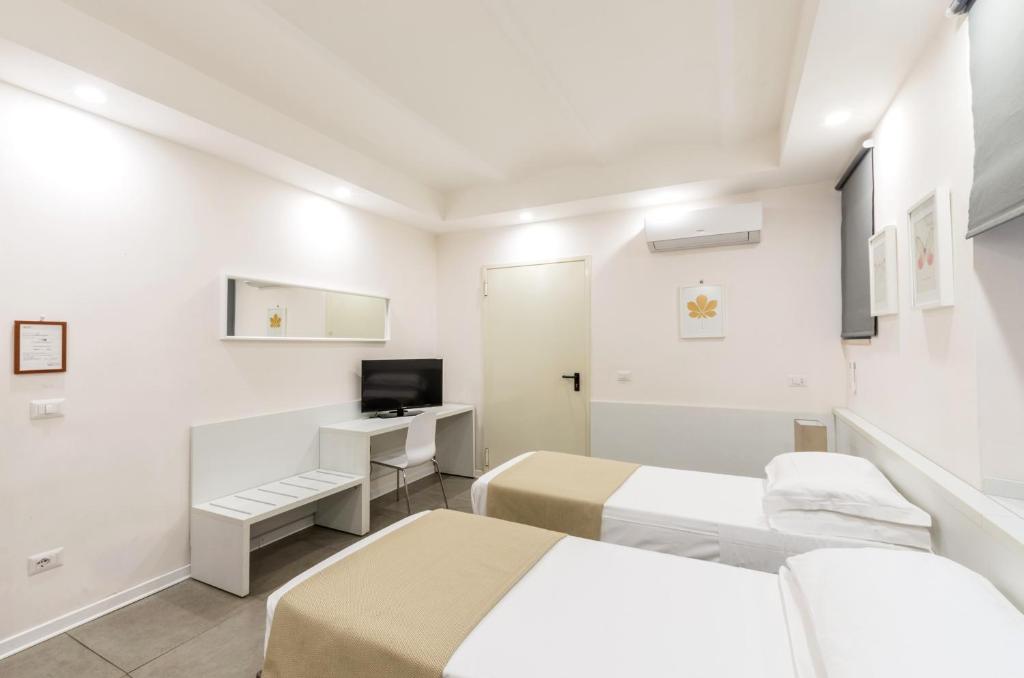 Telewizja i/lub zestaw kina domowego w obiekcie Hotel Tempio Di Pallade