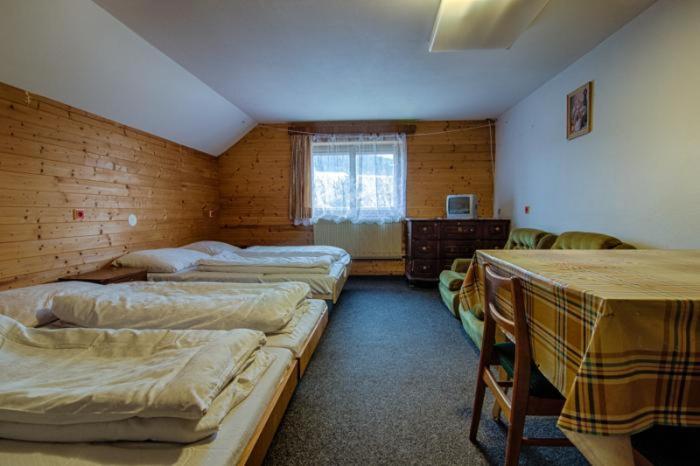 Postel nebo postele na pokoji v ubytování Apartmany Pohořaly