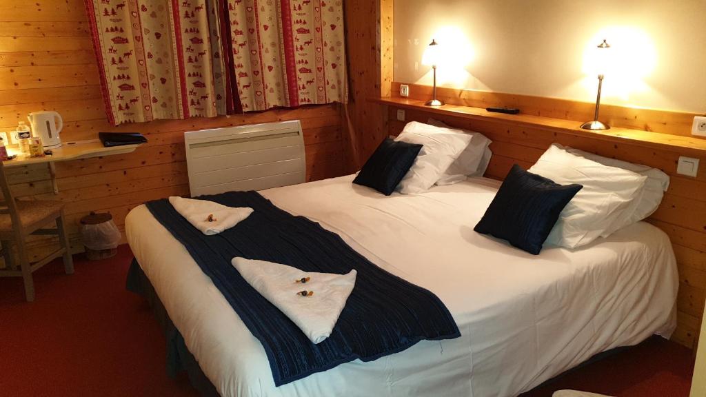 Postel nebo postele na pokoji v ubytování Cit'Hôtel le Welcome