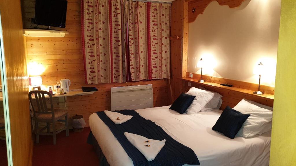 Postel nebo postele na pokoji v ubytování Cit'Hôtel le Welcome
