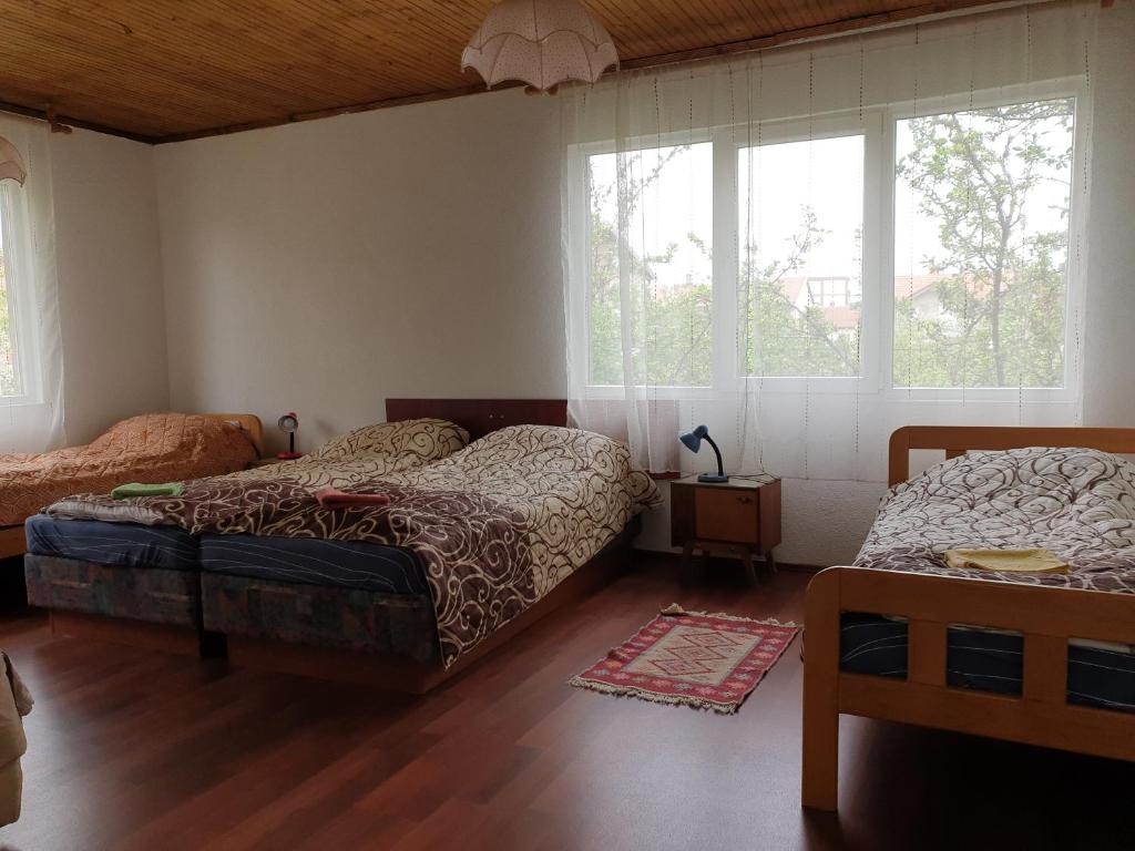 מיטה או מיטות בחדר ב-Bajam Apartments