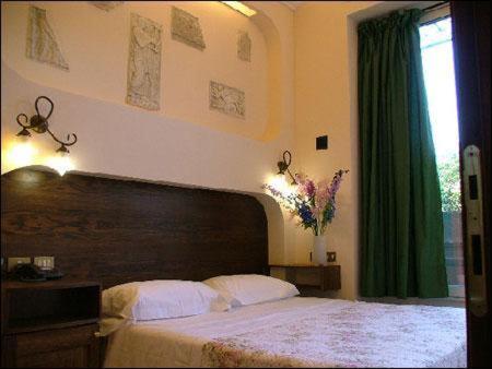 Postel nebo postele na pokoji v ubytování Hotel OKAPI