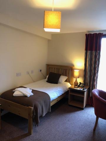 Postel nebo postele na pokoji v ubytování The Brae Hotel