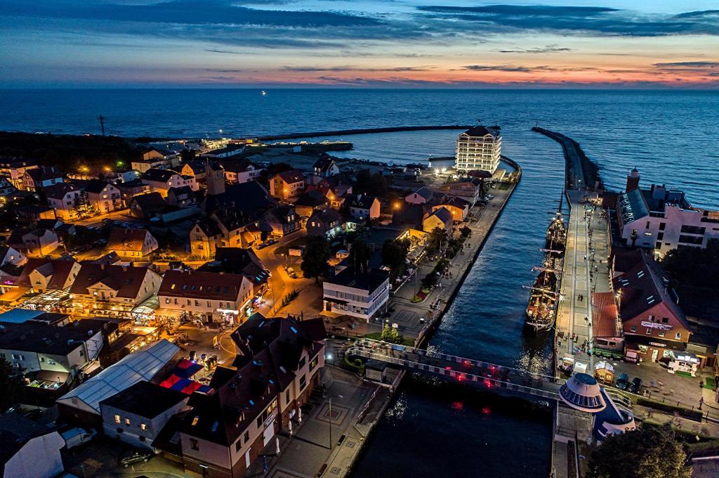 an aerial view of a city at night at Bosmanska 11 in Darłówko