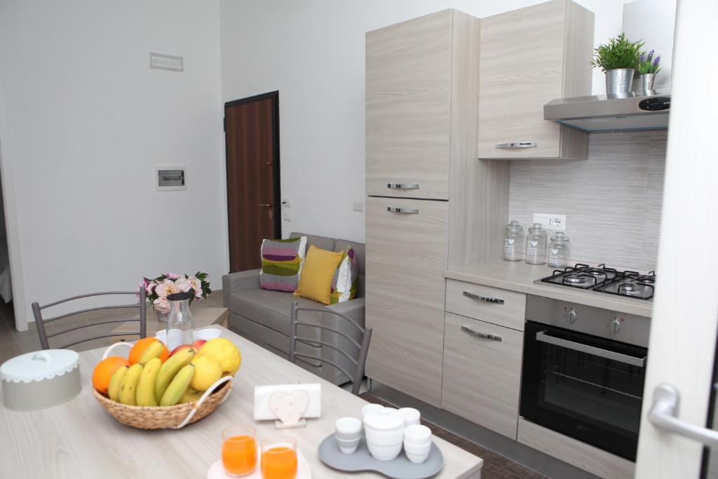 A kitchen or kitchenette at Rosy House - Hospitality