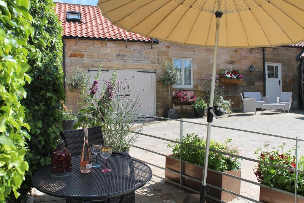 Patio nebo venkovní prostory v ubytování The Coach House