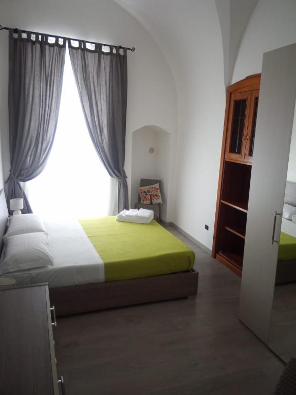 Postel nebo postele na pokoji v ubytování B&b SAN LORENZO