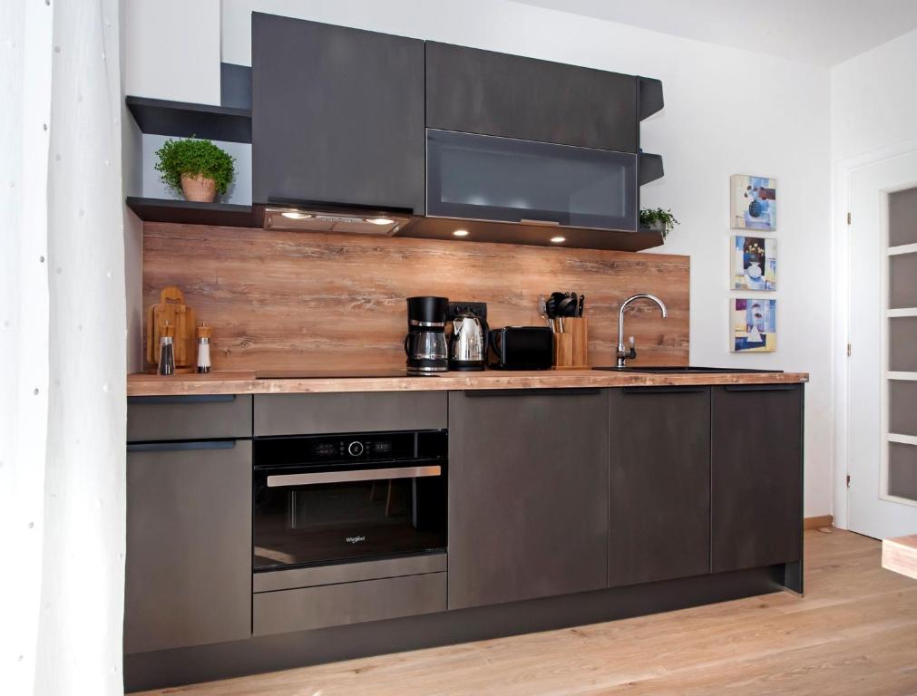 Kuchyň nebo kuchyňský kout v ubytování Apartments Figarola