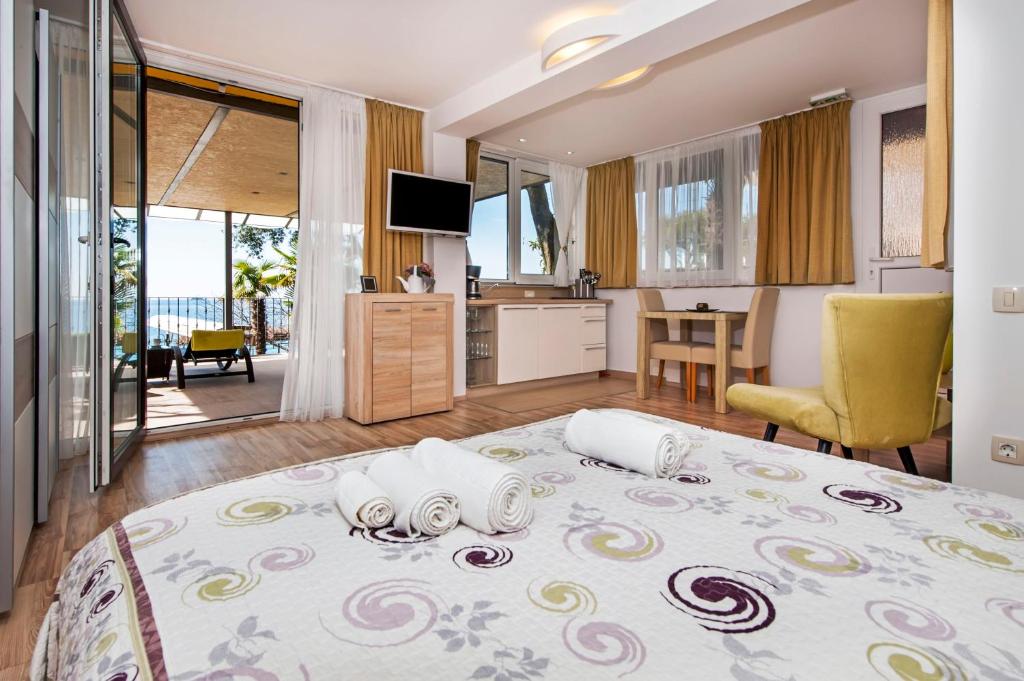 Postel nebo postele na pokoji v ubytování Apartments Figarola