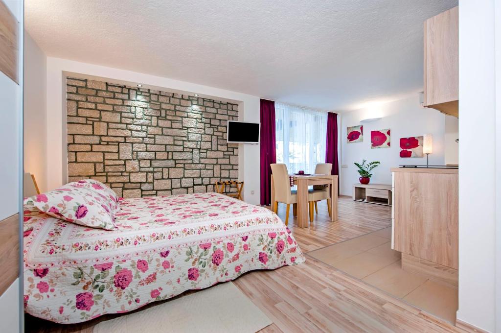 Kuchyň nebo kuchyňský kout v ubytování Apartments Figarola