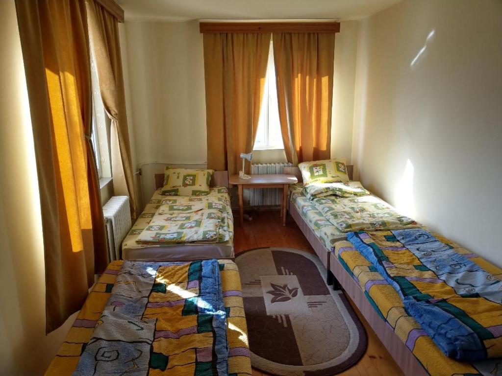 Postel nebo postele na pokoji v ubytování Lary Hostel