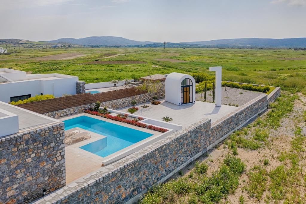 an aerial view of a villa with a swimming pool at Prasonisi Villas in Kattavía