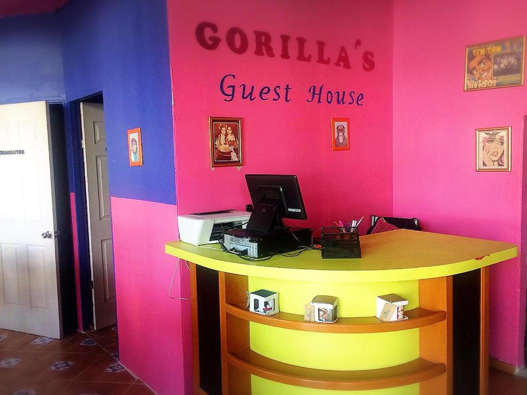 a colorful office with a desk with a computer on it at Gorilla´s Guest House in Puebla