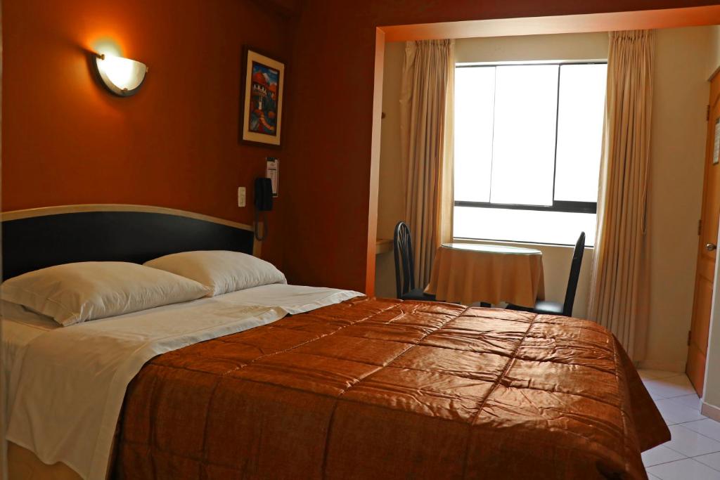 Postel nebo postele na pokoji v ubytování Hotel Bohemia