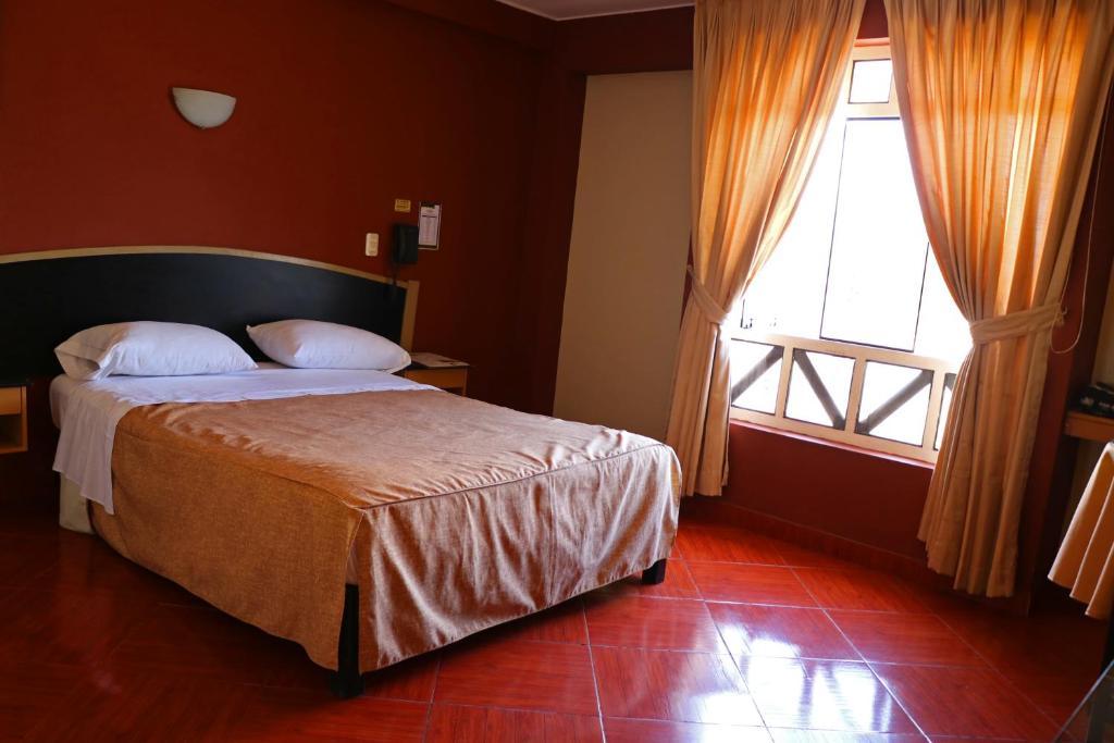 Postel nebo postele na pokoji v ubytování Hotel Bohemia