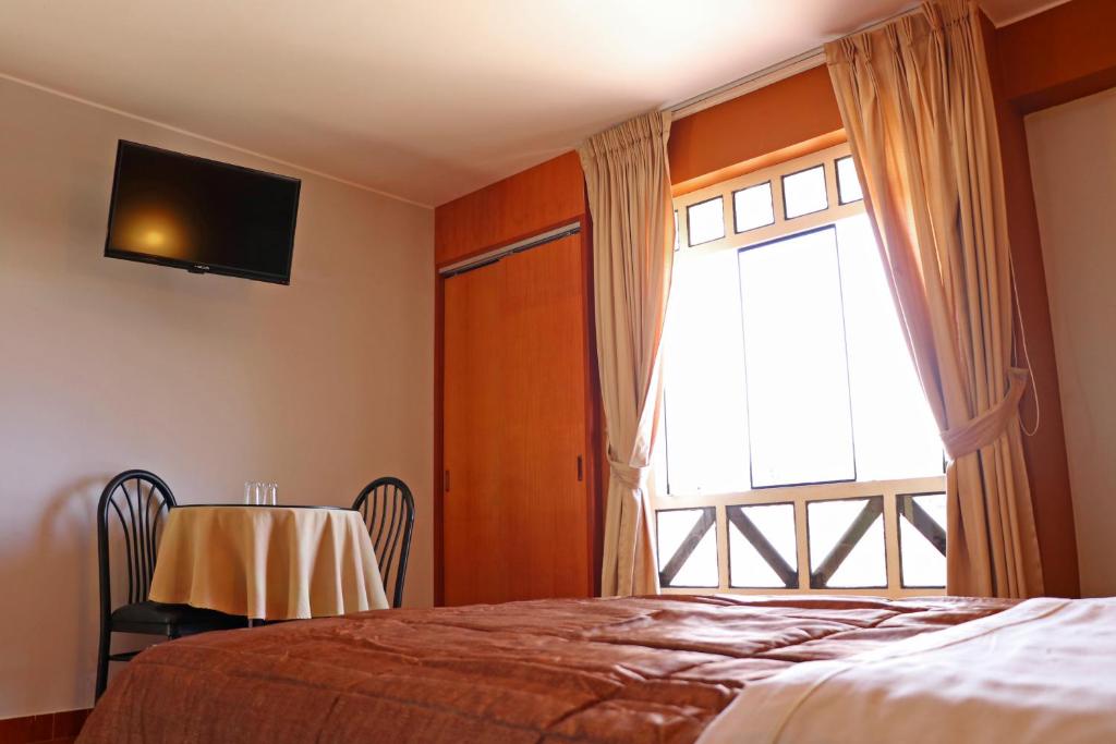 Postel nebo postele na pokoji v ubytování Hotel Bohemia